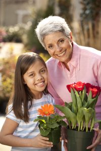 grandma and grandaughter with flowers